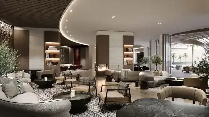JW Marriott Residences shared lounge with fireplace and sea-facing seating
