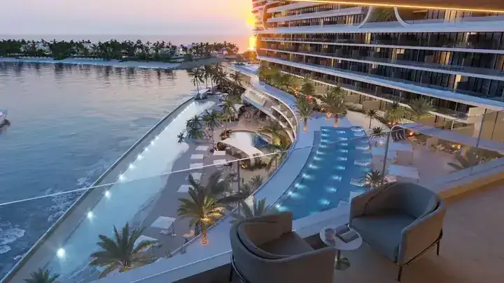 JW Marriott Residences balcony view over resort pools and the waterfront at sunset