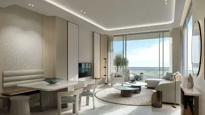 JW Marriott Residences living room and dining area with sea-facing terrace