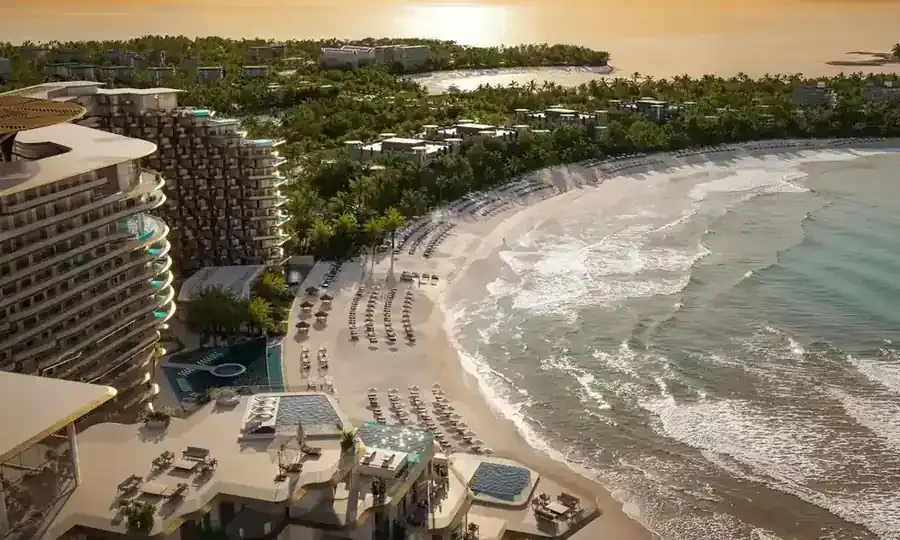 Aerial view of the private beach and seafront buildings at Karl Lagerfeld Beach Residences