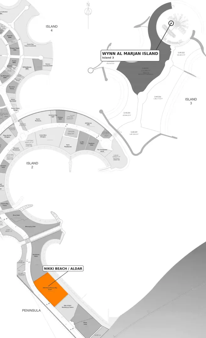 Al Marjan Island masterplan showing Nikki Beach Residences as the only colored plot and the Wynn Al Marjan Island location on Island 3 in muted black and white