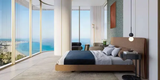 Palazzo Tissoli furnished bedroom with floor-to-ceiling windows and sea outlook