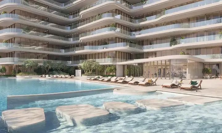 The Astera infinity pool and beachfront amenity deck