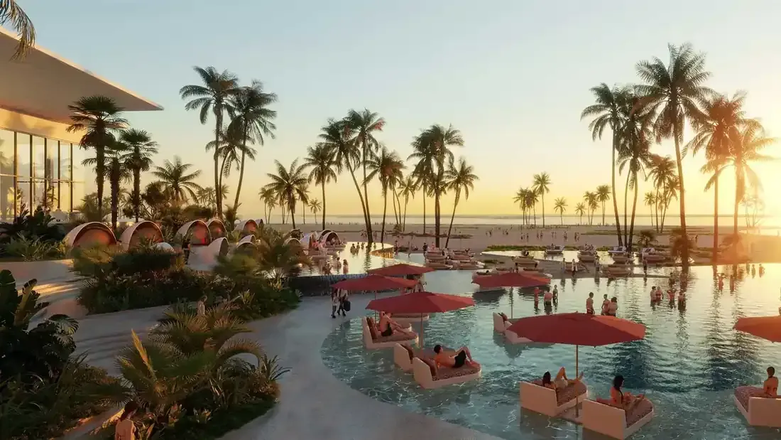 Family pool and beachfront landscape at W Residences